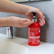 Dispensador de jabón en forma de extintor