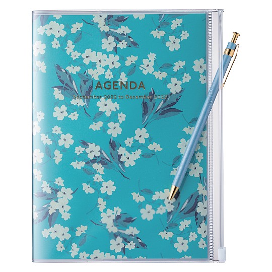 La agenda 2023 de diseño japonés disponible con estampado de flores blancas en fondo turquesa 
