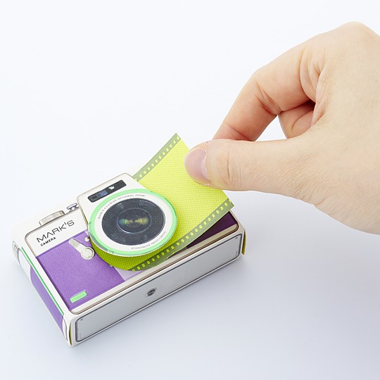 El dispensador es una pequeña cámara de fotos